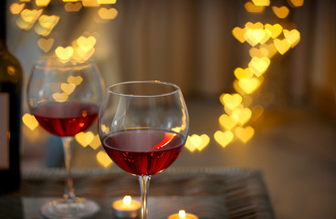 Romantic composition with wine on blurred background