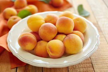 Fresh apricots on plate