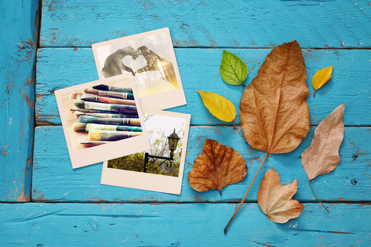 Autumn background with dry leaves and old photo frames