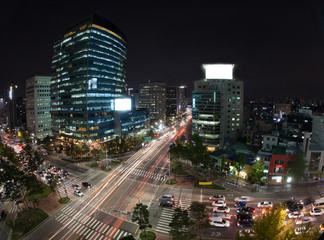 Fototapeta na wymiar High angle shot of night metropolis Seoul in South Korea. Illuminated buildings and busy city motorways