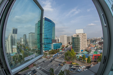 Obraz premium Wide angle shot of city panorama with intense car traffic on the streets. View from the window to Seoul, South Korea