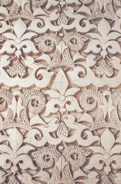 Moorish pattern from Alhambra, Granada, Spain - Closeup of a plaster wall with islamic floral motif