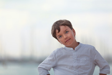 Portrait of happy boy on background of sea,