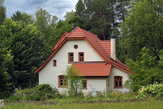 White vintage house in the forest