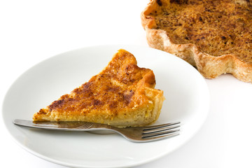 Homemade pumpkin pie on a plate isolated on white background

