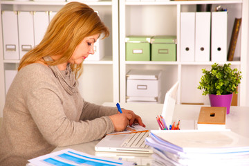 the woman behind the desk in the Office