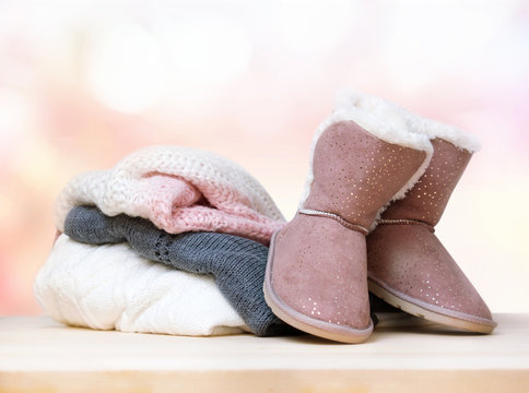 Pair of winter shoes uggs knitted clothes.