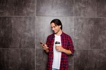 happy man read message on phone and drink coffee