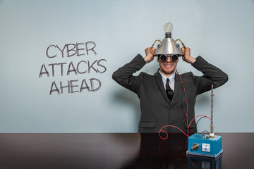 Cyber Attacks Ahead text with vintage businessman