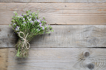 Thyme on wooden background