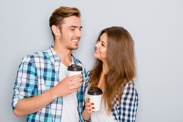 happy young couple in love drinking coffee and looking each othe