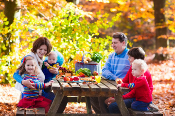 Family having picnic in autumn