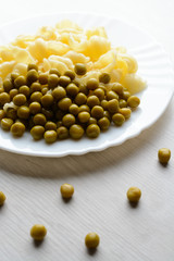 Cones with peas on a white plate