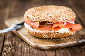 Bagel with Salmon on wooden background