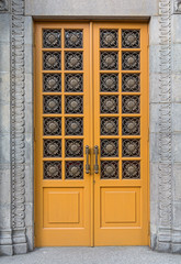 Yellow door in a classic style. Architecture
