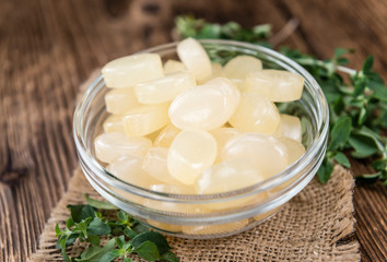 Menthol Candies on wooden background