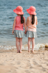 Beautiful twins near the sea