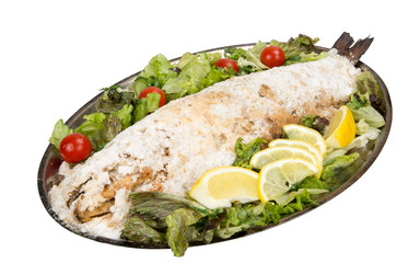 Portion baked fish with lemon, cherry tomatoes and lettuce.