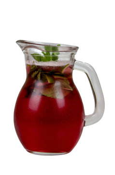 Cooling drink of blackcurrant with lemon and mint leaves.