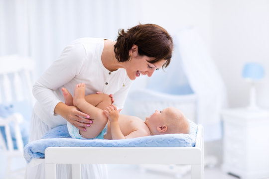 Mother and baby on changing table
