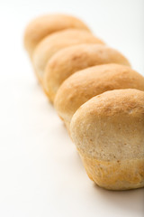 freshly baked, home made bread buns on white background