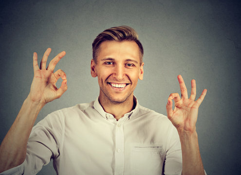 happy man showing OK gesture with hands
