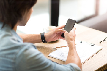 Pleasant man using cell phone