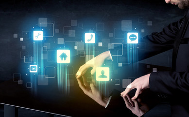 Modern smart table with high tech icons on its interface screen