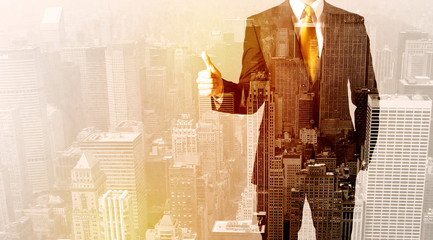 Fototapeta premium Business man looking at overlay city background