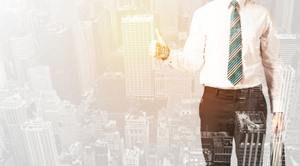 Business person with warm color overlay of city background