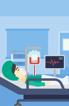 Patient lying in hospital bed with heart monitor.