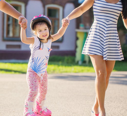 little girl learning to roller skate