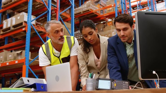 Warehouse workers working together 