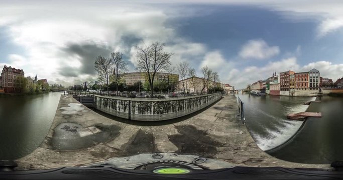 City on a River Video 360 vr Little Planet Video Embankment Bridge Vintage Buildings Cars Clouds Are Floating by Sky Sun Shines Blue Sky Opole Poland