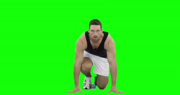 Athlete man running from the starting block