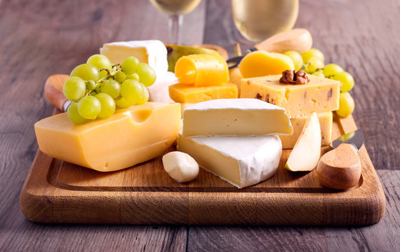 Many sorts of cheese with fruits