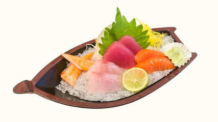 Japanese style assorted sashimi set with crab stick on dish laid over crushed ice