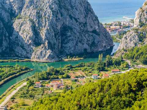 Estuary of the river Cetina. The dalmatian city Omis is visible through the ravine.