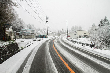 Fototapeta na wymiar Road on snow in of Japan