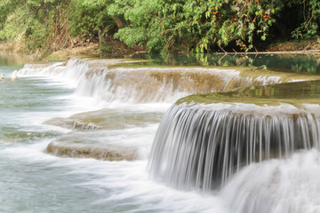 Fototapeta na wymiar Small Water flow trough rock part of waterfall, Nakhon Nayok, Thailand