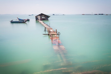 Water overflow on a broken wooden bridge