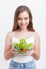 Girl enjoying salad she made herself