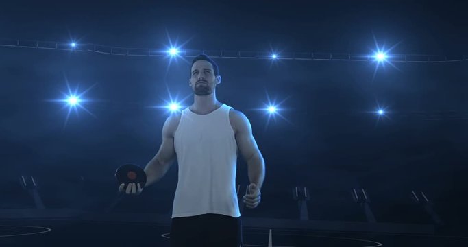 Sportsman is preparing to do discus throw against flashing lights