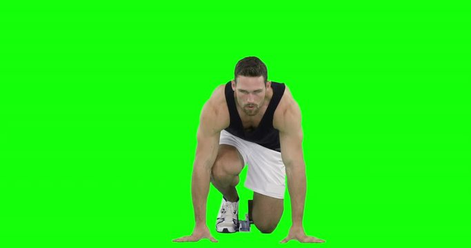 Athlete man practising to run from the starting block