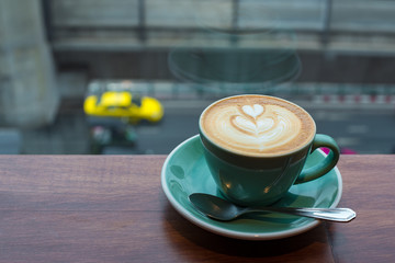 The morning coffee in the city on the cloudy day.