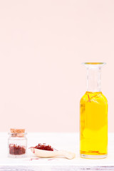 Saffron pistil in spoon and saffron tea 