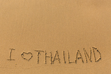 I Love Thailand - manually written in the line of surf sea sand.