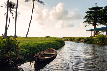 Boat on the river at sunrise on a tropical island Koh Samui