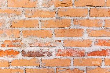 Old wall made of bricks with cement.