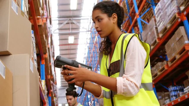 Warehouse workers working together 
